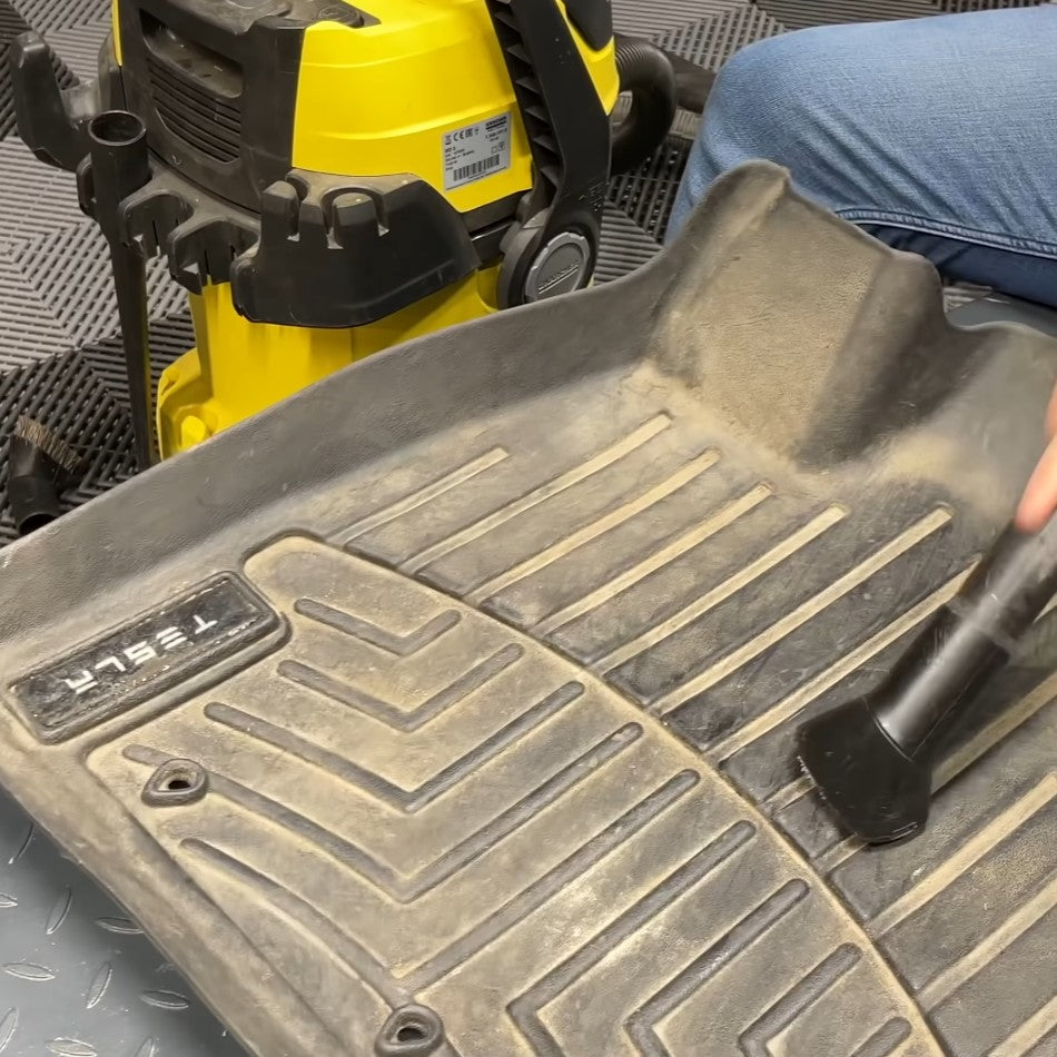 Vacuuming rubber car mat