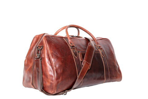 A sleek leather duffle bag for men, made of durable material, with a shoulder strap and multiple compartments. A great Valentine's Day gift for the stylish and practical man in your life.
