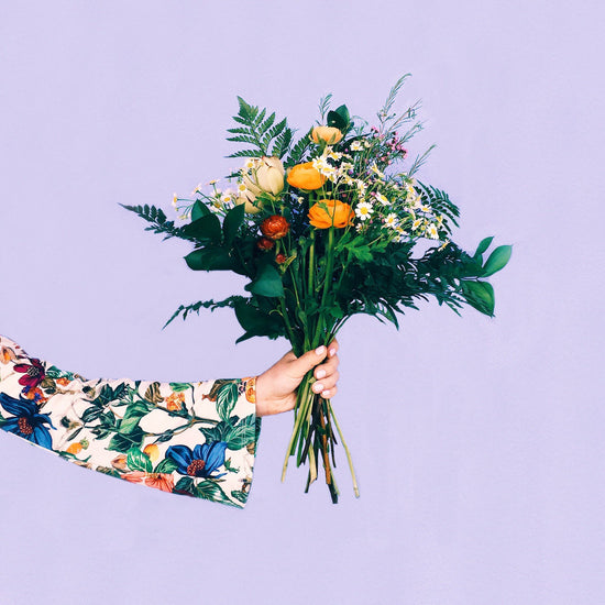 Person giving flowers