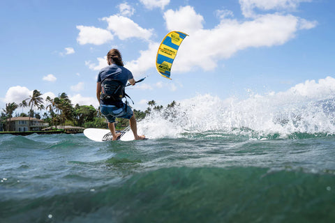 Flite kite on water with surfboard