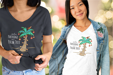 woman wearing a t-shirt with a palm tree decorated with lights and a partridge in a palm tree