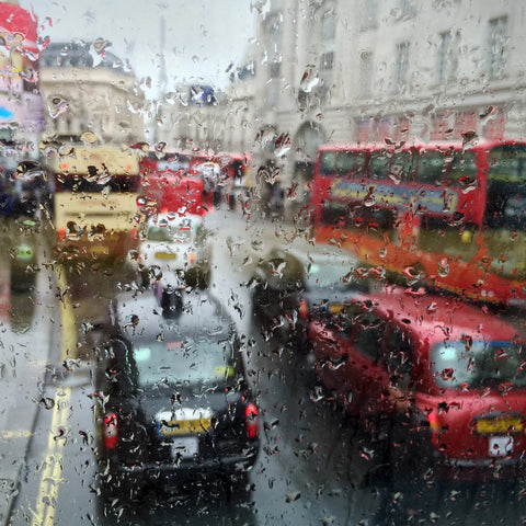 A photo of a busy UK street in the middle of a rainy downpour