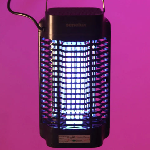 A photo of a Senelux Electric Bug zapper hanging with a purple background