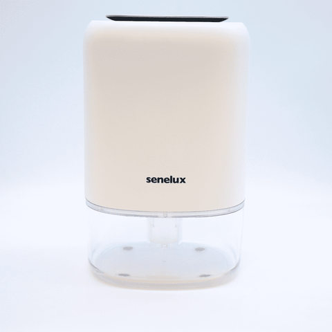 A picture of the NEW Senelux Q4 Dehumidifier presented against a light blue Senelux background.