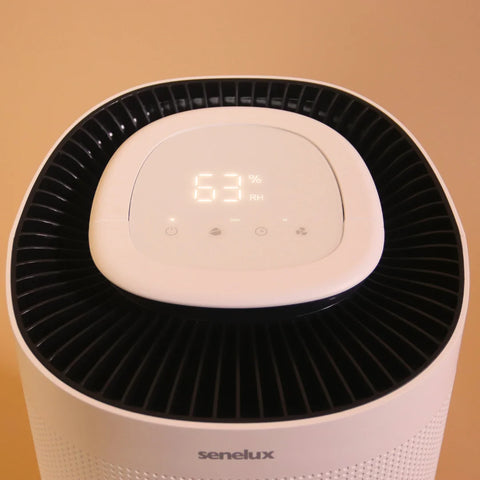 A picture of the top of a Senelux 12 litre per day Dehumidifier against an orange background