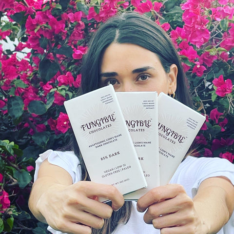 Maria Garces, Fungible Chocolates Founder Holds 3 Fungible Chocolates Bars