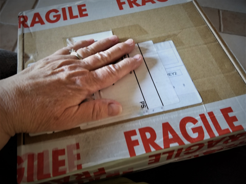 hand sticking label and fragile sticker