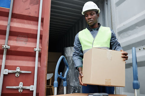 man holding shipping box