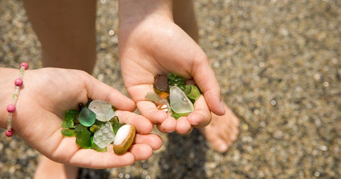holding sea glass in palms
