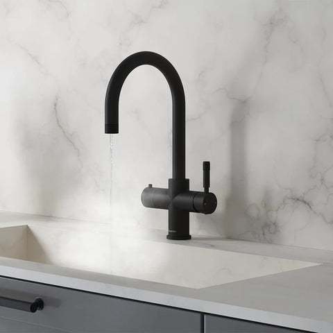 a matt black 4-in-1 water tap inside a kitchen with white tiles