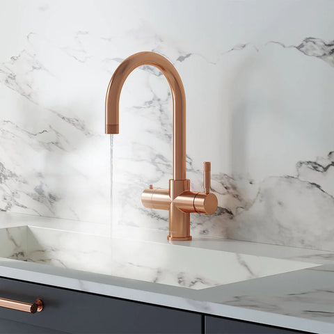 a rose gold 4-in-1 kitchen tap