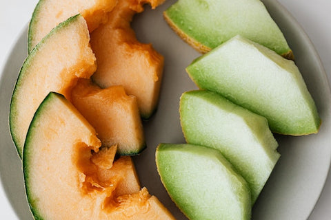 Plate of sliced natural colourful assorted melons