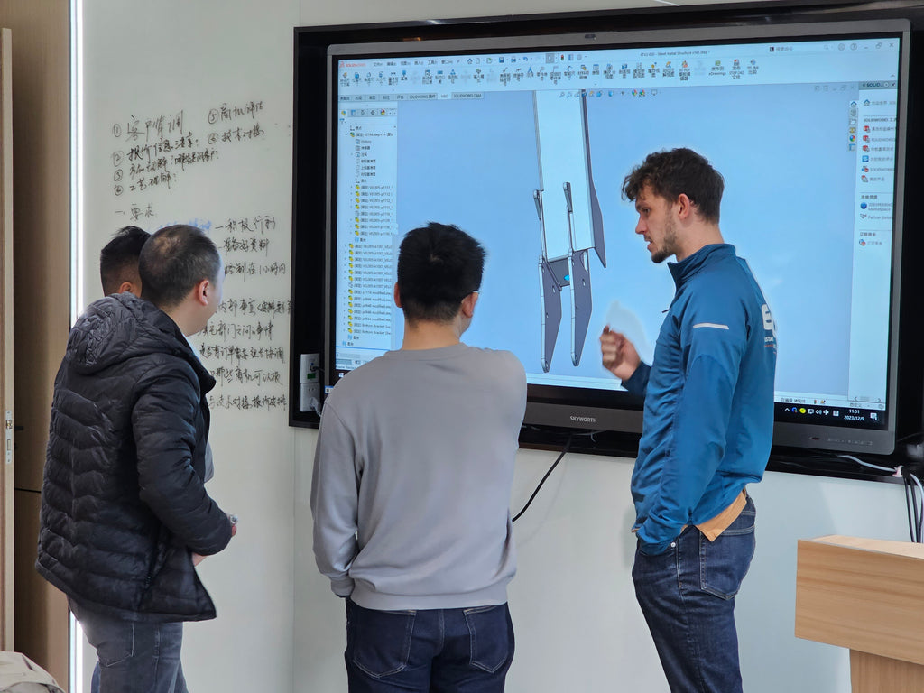 discussing the engineering drawings with our manufacturing team