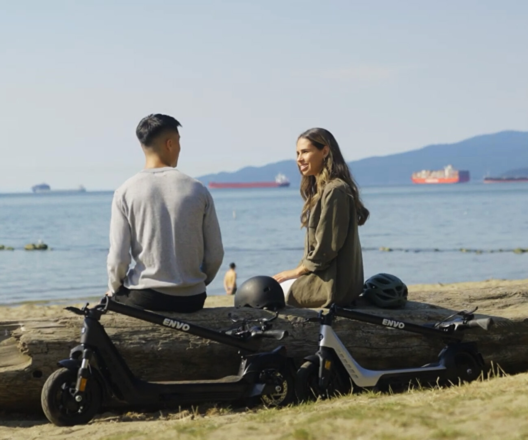 A Couple Riding an Electric Scooter | ENVO