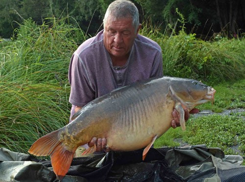 Ken holding a 43lb 12oz carp.