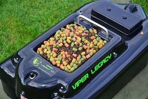 Coloured boilies on a small black bait boat.