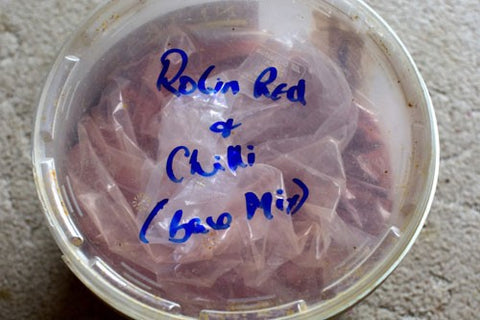 Robin Red Base Mix (labelled) in a bucket.