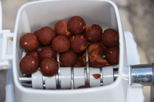 Red boilies in an ice crusher.