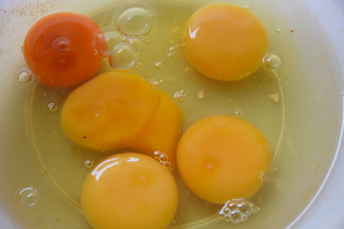 Break five eggs into a bowl