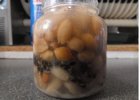 slowly pour the prepared liquid into the jar