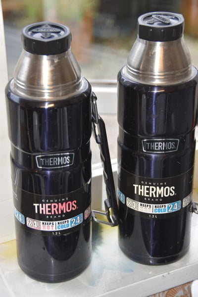 Two black Thermos flasks stood next to each other.