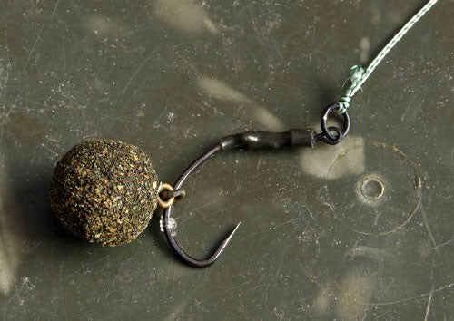 Circular fishing bait on a hook.