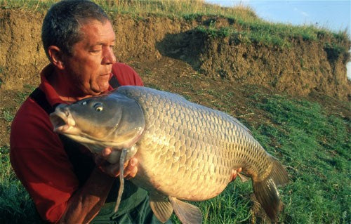 Ken holding a large carp.