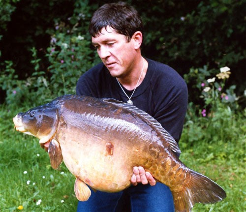 Ken Townley with largest fish in lake.