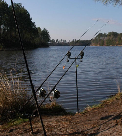 Image of a fishing rod by a lake
