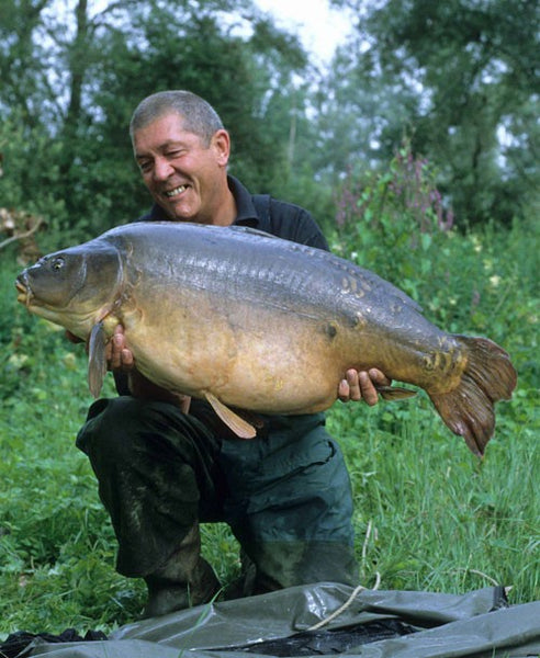 Photo of Ken Townley holding a large carp