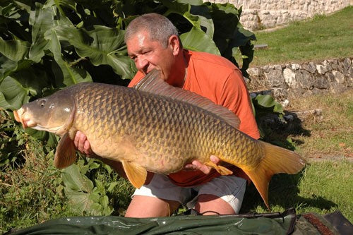 Image of Ken Townley holding a large carp