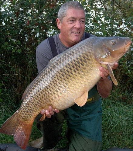 Image of Ken Townley holding a carp