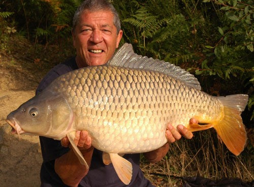 Image of Ken Townley holding a large carp