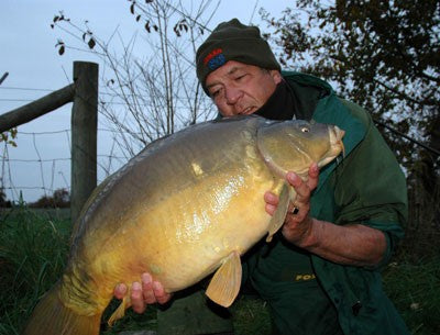 Image of Ken Townley holding a large carp