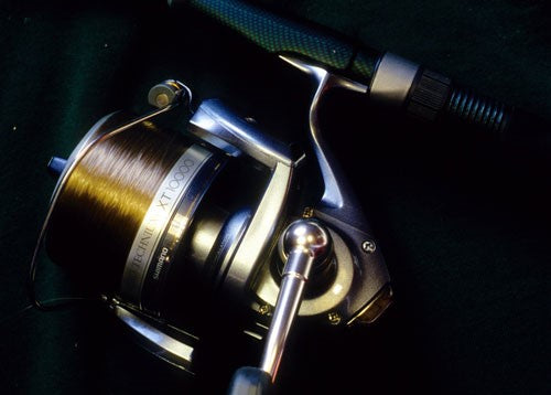 Image of a fishing reel with line attached
