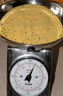 Image of bird food base mix in some weighing scales