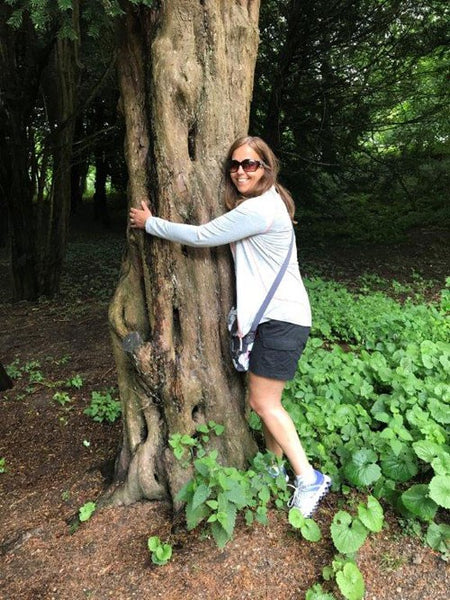 Andrea from Haith's hugging a tree.