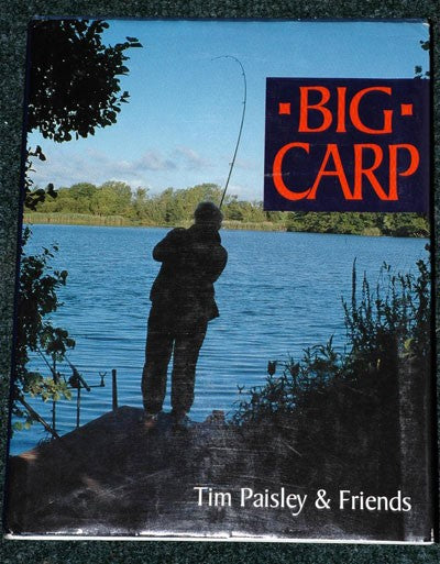 Photo of a book cover by Tim Paisley stood next to a lake with a fishing rod