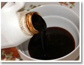 Liquid being poured into bowl to make attractor for fishing.