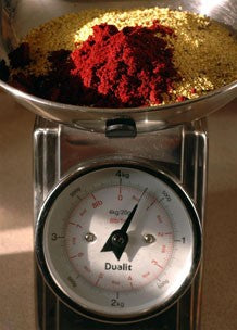 Image of Robin Red and bird food base mix in weighing scales.