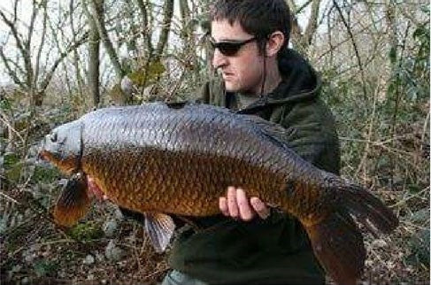 Andy O'Brien holding big catch.