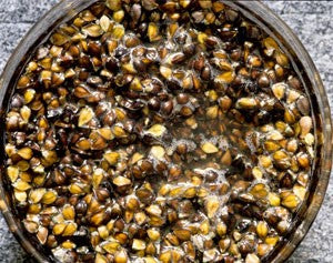 Photo of cooked buckwheat in a black bucket