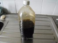 Liquid in bottle from the boiling of tiger nuts.