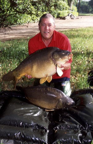 Image of Ken Townley holding a large carp