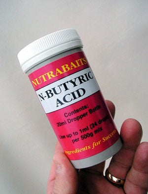 Image of a white container of N-Butyric acid