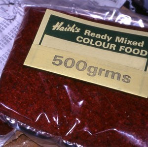 Plastic-wrapped 500 rams of red-coloured, Ready Mixed Colour Food.