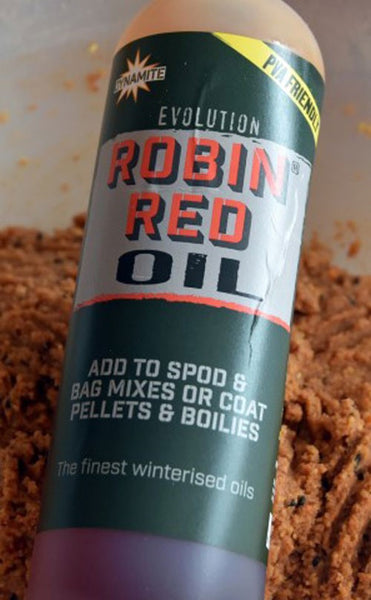 Bottle of Robin Red Oil for fishing.