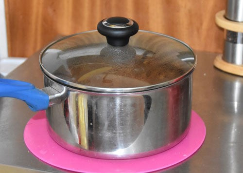 Silver saucepan with lid on top.