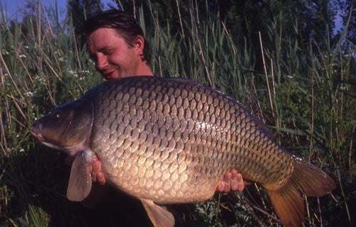 Xavier holding a huge carp fish.