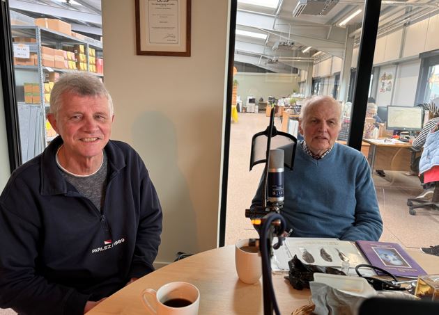 Photograph of Chris Snell and Professor John Cooper inside Haith's office prior to regarding their podcast